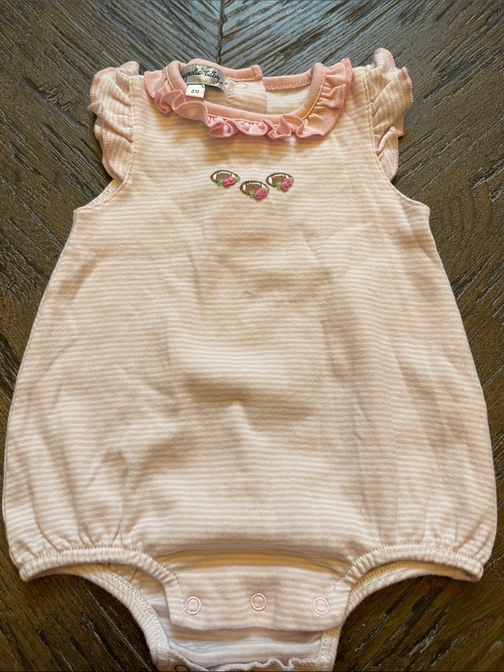 Magnolia Baby Pink Ruffled Football Onesie